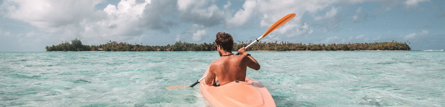 person kayaking in the ocean